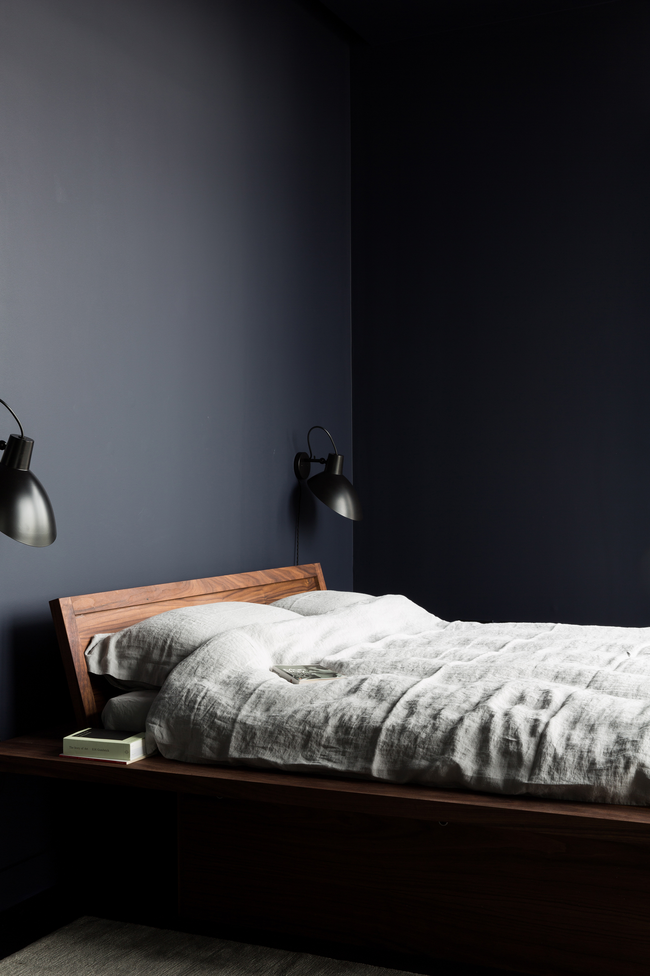 Dark and minimal bedroom at The Cereal ABODE at the Greenwich Peninsula Dark and minimal bedroom at The Cereal ABODE at the Greenwich Peninsula